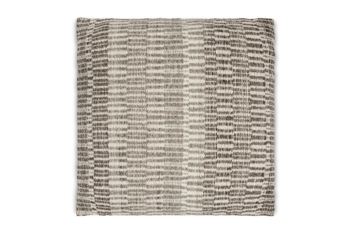 The Aahna Wool Cushion Cover by nkuku features a textured, woven design in charcoal, made from wool and recycled polyester with abstract horizontal and vertical lines for a stylish, striped look.