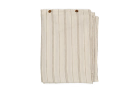 A neatly folded pair of beige pants with vertical thin brown stripes and two brown buttons at the waistband, echoing the natural sage green tones of the nkuku Anta Hemp & Cotton Duvet Cover.