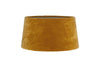 The nkuku Batakha Velvet & Linen Lampshade in dark ochre features a slightly tapered cylindrical shape and adds elegant lighting to any space.