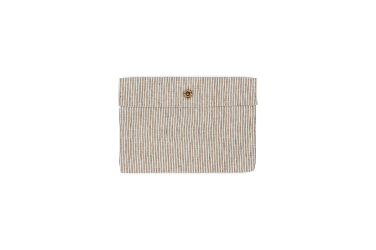 A beige, rectangular hemp and cotton pouch with thin espresso stripes and a central brown button, inspired by nkuku’s Borba Housewife Pillowcases, is shown on a white background.