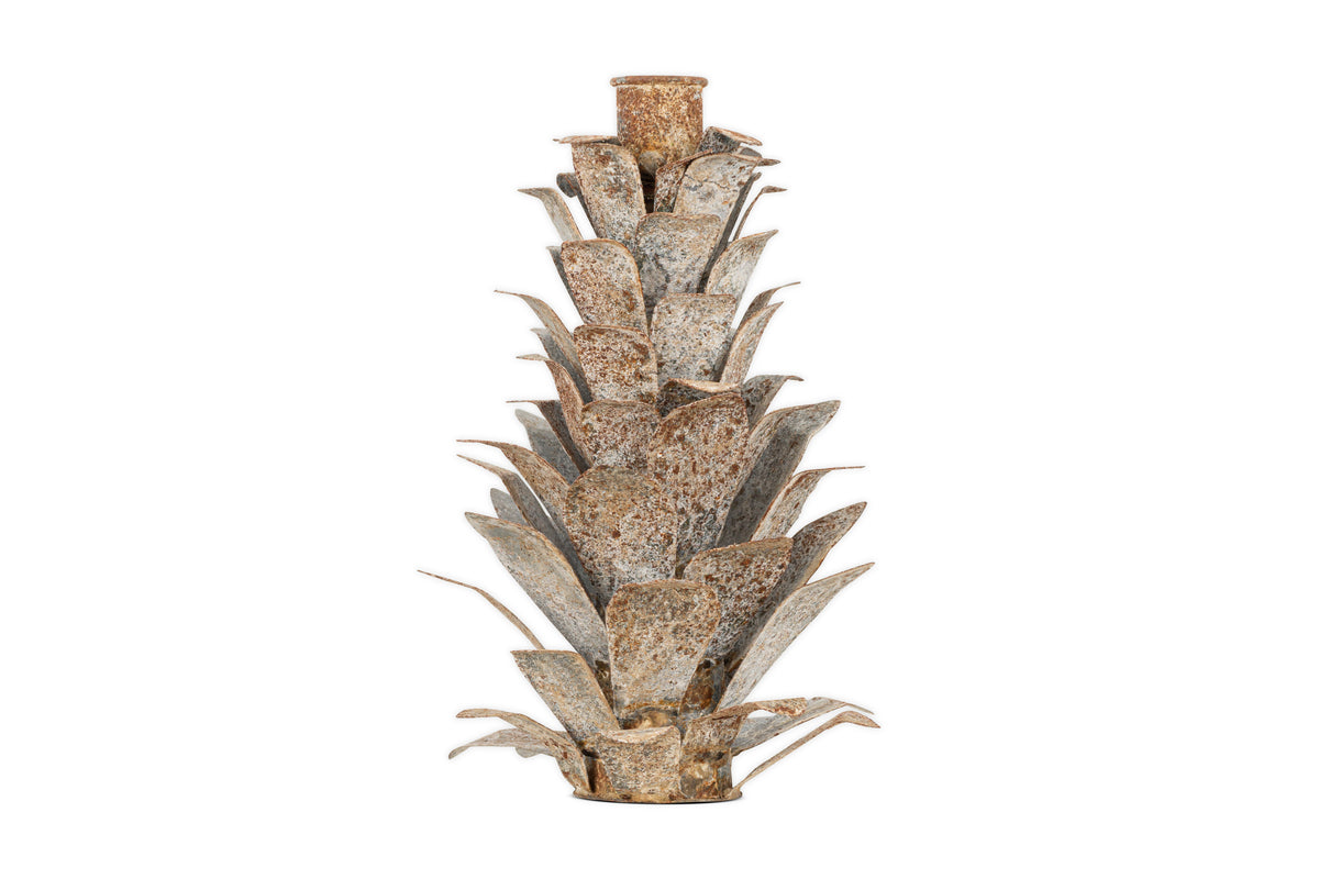 The nkuku Elagalu Pine Cone Candle Holder in zinc features layered, textured leaves fanning outward in tiers and a circular space for a candle at the top—ideal as festive tabletop decor. Background is plain white.