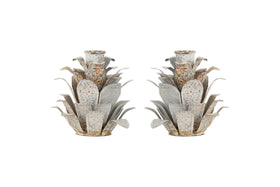 The nkuku Elagalu Pine Cone Candle Holders (Set of 2) are crafted from zinc with layered, spiky details and a rustic finish—stylish festive accents or unique Christmas candleholders for your tabletop.