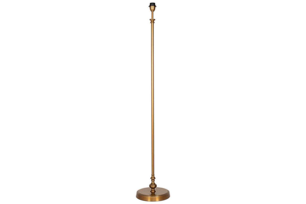 The nkuku Ehadi Antique Floor Lamp features an antique brass pole and a sleek black shade, offering modern elegance to any room.