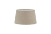 The Embaata Linen Lampshade by nkuku features a natural, textured linen design in beige with a subtly flared cylindrical shape, shown against a plain white background.