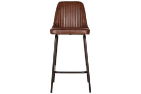 The Harsha Leather Counter Chair by nkuku in chocolate brown features a ribbed, cushioned backrest and seat, with slim black metal legs and a footrest. Shown from the front against a white background; ideal for stylish kitchen island seating.