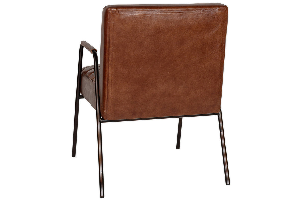 The Hadithi Leather Occasional Chair by nkuku in chocolate brown features a ribbed design, high backrest, and slim black metal legs and armrests, shown from the back.