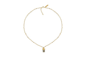 The Hadari Labradorite Necklace by nkuku features an irregular gray labradorite stone pendant on a delicate gold chain, showcased against a white background.