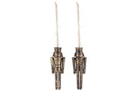 The Imay Nutcracker Baubles - Antique Brass (Set of 2) by nkuku feature metal figures with an antique gold finish and rustic twine loops. Each mini bauble has a tall hat, simple features, and straight limbs—ideal festive décor for your Christmas tree.