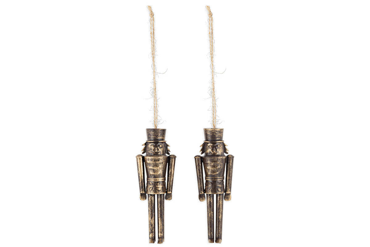 The Imay Nutcracker Baubles - Antique Brass (Set of 2) by nkuku feature metal figures with an antique gold finish and rustic twine loops. Each mini bauble has a tall hat, simple features, and straight limbs—ideal festive décor for your Christmas tree.