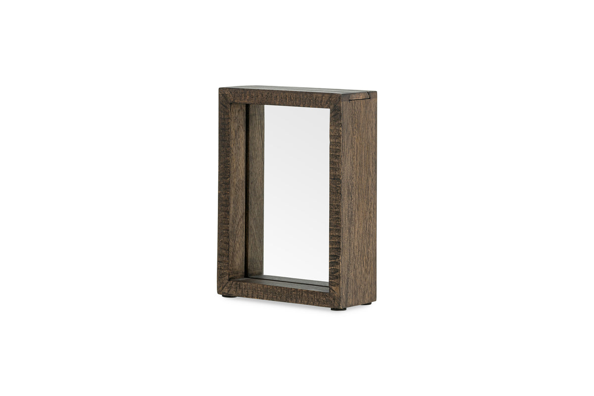 The Indu Standing Mango Wood Frame - Dark Ash by nkuku is a rectangular mirror with a dark, textured, sustainable mango wood frame, displayed upright on a white background.