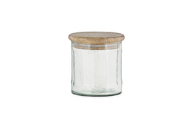 The nkuku Igoko Storage Jar - Clear features a textured glass body and a round, flat mango wood lid, making it a stylish kitchen organizer. Shown on a white background.