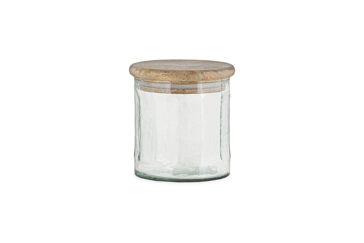 The nkuku Igoko Storage Jar - Clear features a textured glass body and a round, flat mango wood lid, making it a stylish kitchen organizer. Shown on a white background.