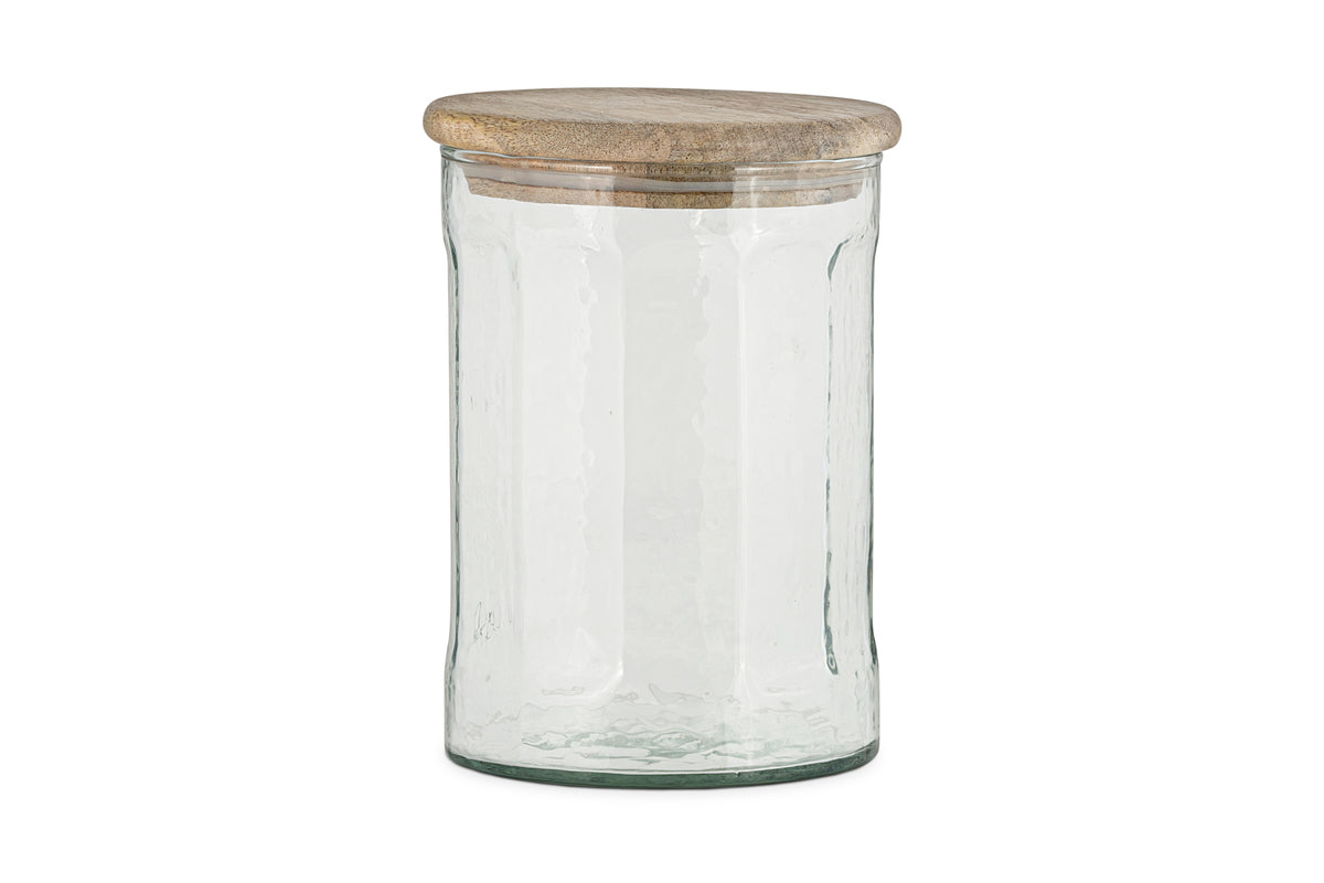 The nkuku Igoko Storage Jar - Clear features a textured glass body and a round mango wood lid, making it a stylish kitchen organizer. Shown against a plain white background.