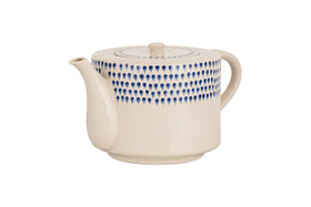 The nkuku Indigo Drop 4 Person Teapot - Cream & Indigo features a cream ceramic finish, curved spout and handle, and hand-painted blue teardrop design—combining modern style with function, its perfect for gifting to tea lovers.