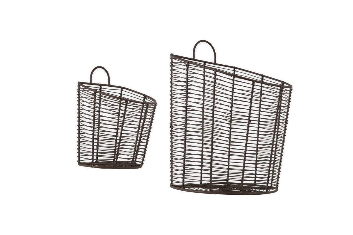 The nkuku Inkollu Wall Hung Baskets in aged brass (set of 2) feature an open grid design with angled openings and rounded top handles—ideal for pantry storage—shown against a plain white background.