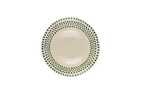 The Juniper Drop Cereal Bowl by nkuku features a cream ceramic finish with a green drop pattern around the rim, perfect for everyday use and shown from above on a white background.
