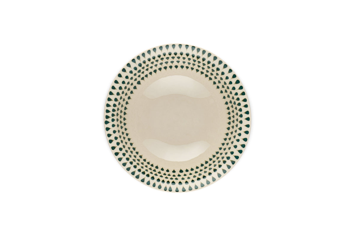 The Juniper Drop Cereal Bowl by nkuku features a cream ceramic finish with a green drop pattern around the rim, perfect for everyday use and shown from above on a white background.