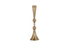 The Javanee Candle Holder by nkuku features a tall, slender silhouette in antique brass with a hammered texture, sculptural elegance, two rounded bulges on its stem, and a flared base. Shown upright against a white background.