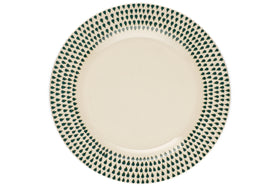 The Juniper Drop Dinner Plate by nkuku features a cream ceramic design with a decorative green drop pattern around the rim, shown from above on a white background.