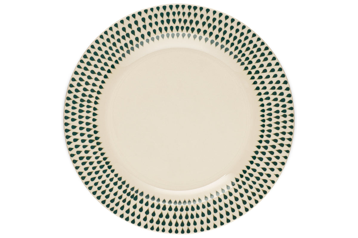 The Juniper Drop Dinner Plate by nkuku features a cream ceramic design with a decorative green drop pattern around the rim, shown from above on a white background.