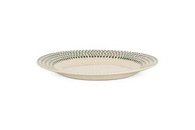The Juniper Drop Dinner Plate - Cream & Juniper by nkuku features a round, cream ceramic design with a blue geometric rim, showcasing modern tableware style against a white background.