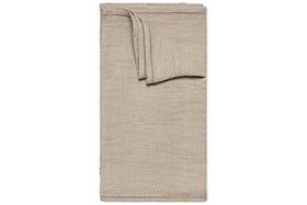 The Junto Linen Runner- Natural - Large by nkuku is displayed on a white background. Its smooth, beige linen finish and crisp edges add elegance and harmony to any table setting.