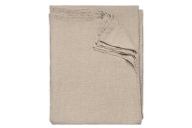The nkuku Junto Linen Tablecloth in Natural (Large) is neatly folded and arranged on a white background.