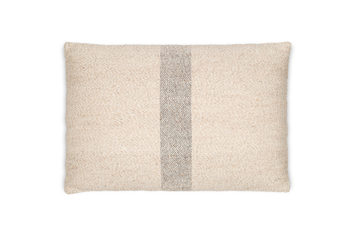 The Kallu Wool & Cotton Cushion Cover - Natural by nkuku features a white base with a sleek black stripe, adding a neutral touch to your space.