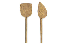 The nkuku Kasa Cheese Knives - Antique Brass (Set of 2) features simple handles and two distinct blades, perfect side by side on a white background to elevate your cheese board.