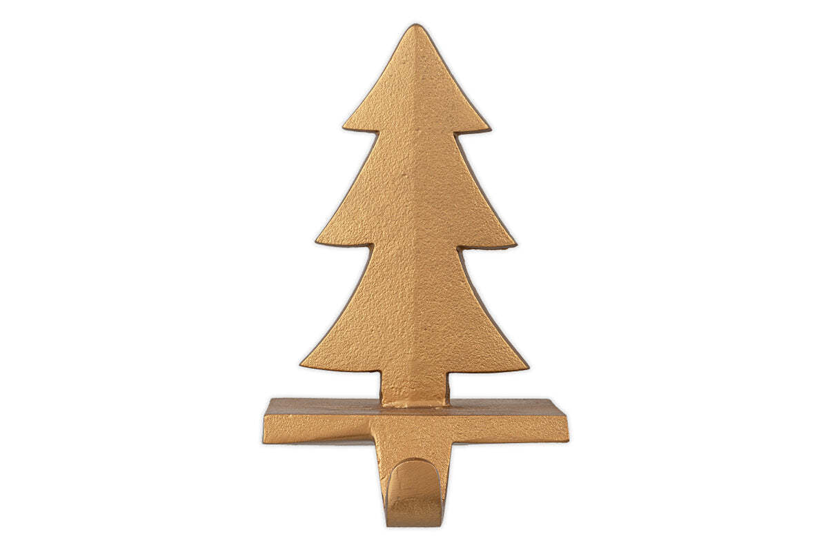 The nkuku Kotta Stocking Tree Holder in antique brass features a stylized Christmas tree design with three layered branches and a rectangular base, making it a festive and elegant way to hang stockings on your mantel.
