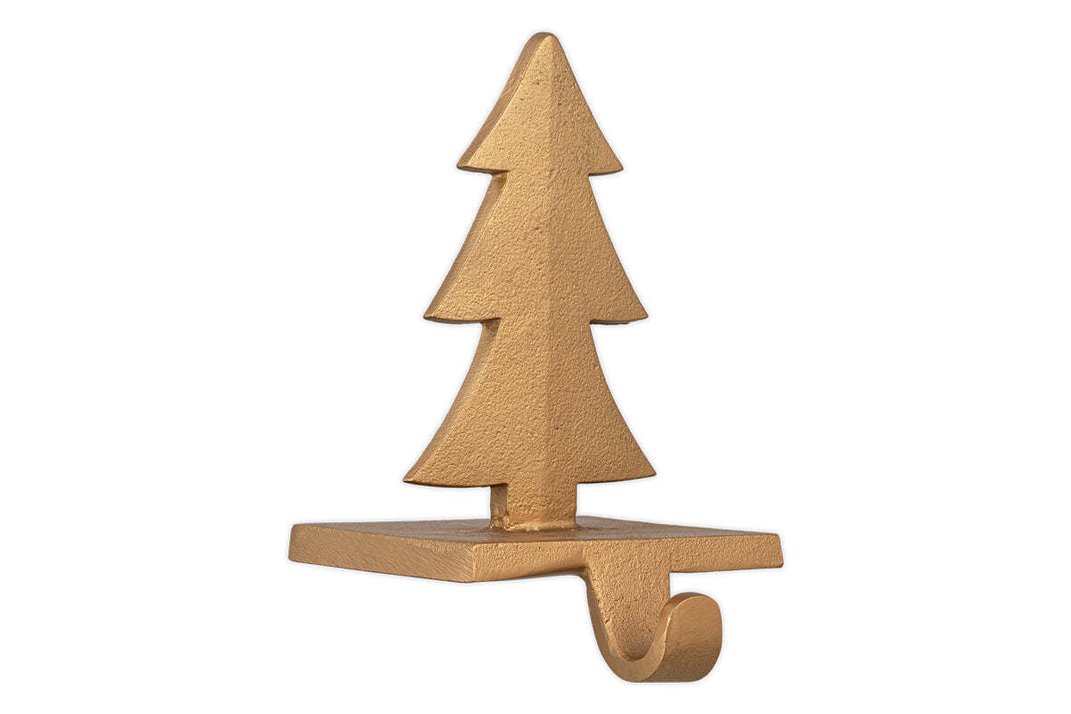The nkuku Kotta Stocking Tree Holder in antique brass features a flat base, curved hook, and three tiered triangular layers with a matte finish—an elegant mantelpiece decoration for hanging stockings or ornaments.