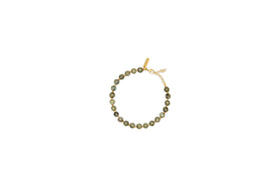 The Marai Bracelet - Labradorite by nkuku features round greenish-brown labradorite beads, a gold clasp, and an adjustable chain. This elegant piece is perfect for jewellery lovers and is presented on a plain white background.