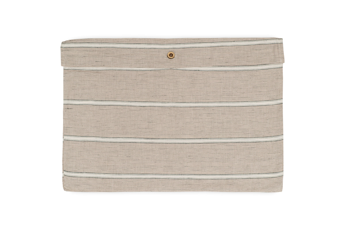 The Mora Hemp & Cotton Duvet Cover by nkuku, shown in stone grey, features horizontal black stripes and a flap closure with a single gold snap button, displayed against a white background.