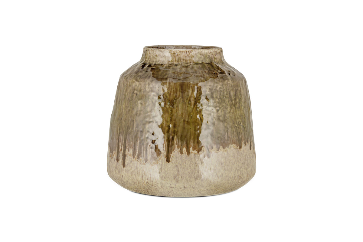 The Melina Reactive Glaze Vase by nkuku features a wide body, narrow opening, and glossy finish. Its olive and natural tones blend in organic dripped patterns, giving it a rustic charm. Displayed against a plain white background.