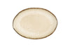 The nkuku Malia Large Oval Platter - Cream features an organic oval shape, cream center, subtle textured lines radiating outward, and a slightly darker irregular rim. The empty ceramic platter is set against a white background.