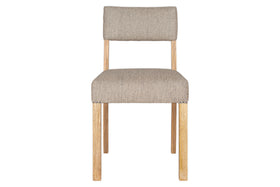 The Nadeeka Linen Upholstered Dining Chair by nkuku features a mango wood frame and soft grey linen cushioned seat and backrest, viewed from the front to highlight its simple, minimalist design.