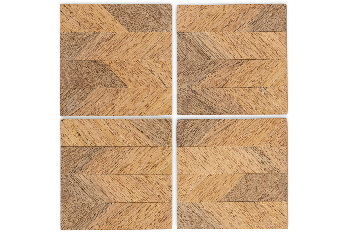 The Nalbari Coasters - Natural (Set of 4) by nkuku feature a chevron pattern in light and dark wood, aligning seamlessly across each piece for a stylish, eco-friendly touch to your table.