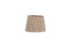 The Nadee Banana Leaf Lampshade by nkuku is a small, cylindrical, natural-colored lampshade made from sustainable banana leaf with a woven texture, shown against a plain white background.