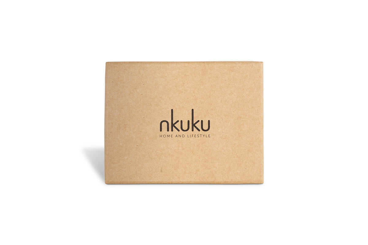 A plain rectangular brown box with "nkuku" and "HOME AND LIFESTYLE" printed in black holds the Enia Mini Hanging Egg Decoration - Antique Teal & Clear (Set of 12), photographed on a white background with a slight left shadow.