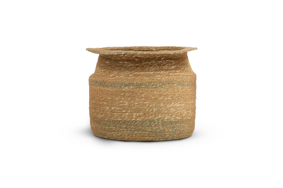The nkuku Rana Tall Basket - Natural & Moss is a handwoven seagrass storage basket with a wide, flat rim and cylindrical body, featuring subtle natural and moss color variations, set against a white background with a soft shadow.