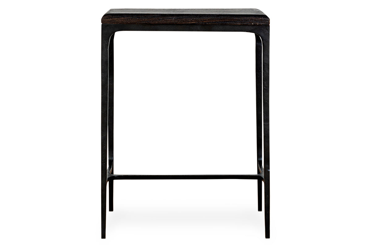 The nkuku Sita Reclaimed Wood & Iron Side Table in chocolate brown features a square reclaimed wood top and slim black iron legs with horizontal supports, offering a minimalist and modern accent for any space.