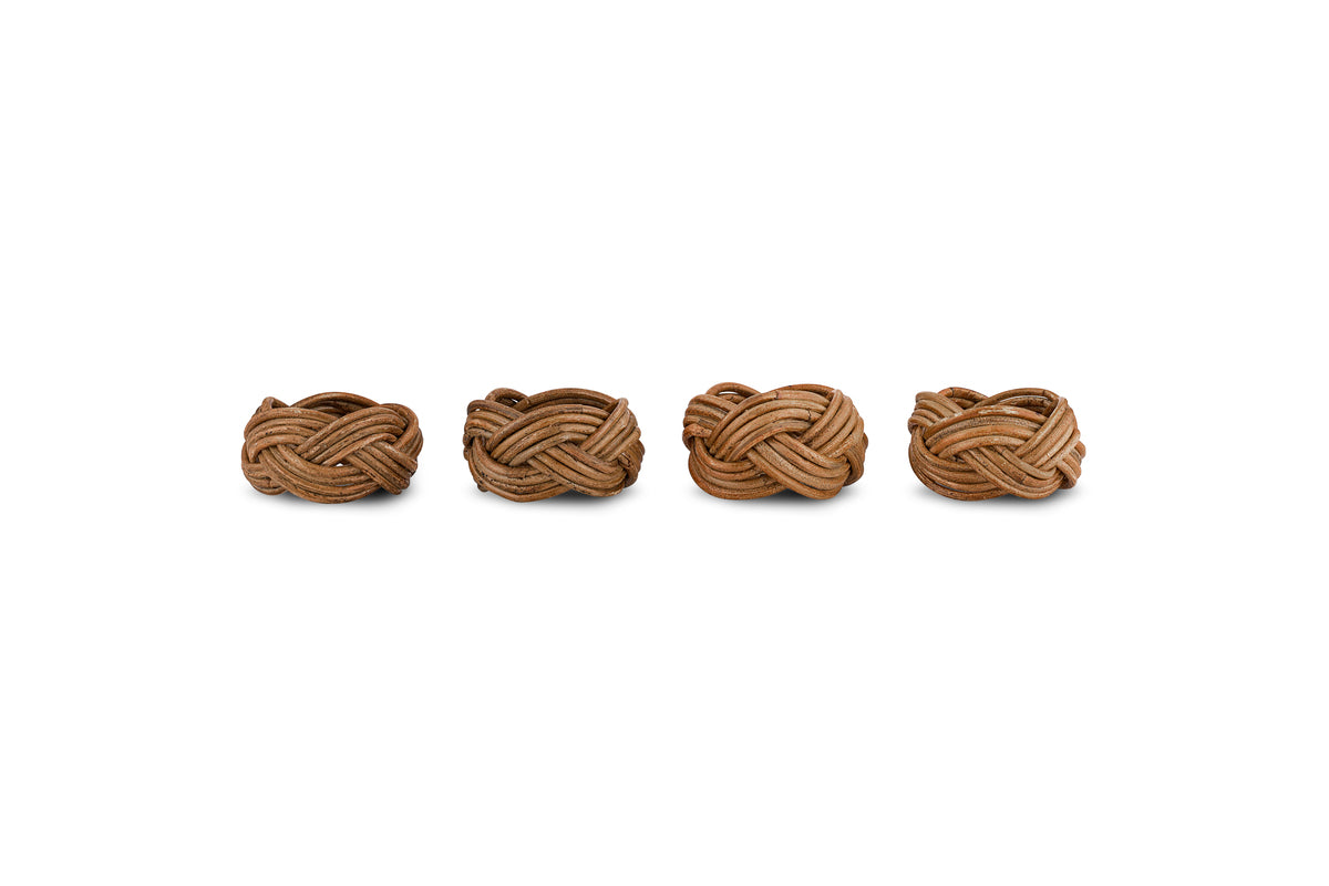 Four nkuku Bersama Rattan Napkin Rings in natural brown, featuring intricate handwoven knots, are arranged in a row—an elegant set of 4 to enhance your table decor.