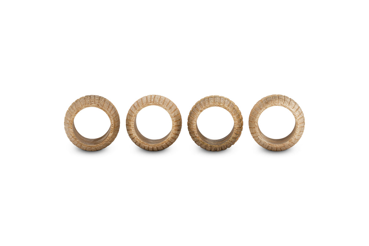The nkuku Vivan Napkin Rings - Natural (Set of 4) feature a woven, basket-like pattern and light brown finish, making them an elegant addition to your table décor.
