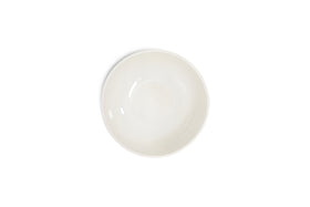 The Edo Cereal Bowl - Terracotta by nkuku is centered on a white background. Its smooth, round ceramic surface and earthy hue highlight minimalist style, with no visible patterns or decorations for a clean, modern look.