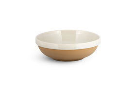The nkuku Edo Pasta Bowl - Terracotta features a matte, light brown exterior and glossy, off-white interior and rim. Its minimalist design with clean lines offers a natural look, shown centered on a white background.