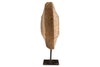 The Cala Reclaimed Wood Objet on Stand - Natural by nkuku is a vertical sculpture crafted from light brown reclaimed wood with a rustic, textured finish. Mounted on a slim metal rod and black base, it adds organic elegance to your decor.
