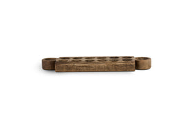 The nkuku Makala Reclaimed Wood Tealight Holder - Natural features a rustic rectangular design with two round tealight cups and twelve carved pits, showcasing weathered wood grain for unique, cultural decor against a white background.