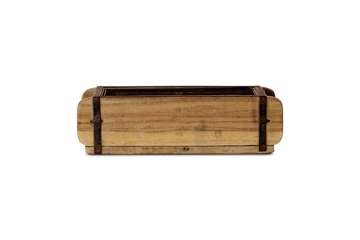 The Dudha Reclaimed Brick Box - Natural by nkuku is a rectangular, rustic indoor planter with rounded corners, metal-reinforced edges, and a natural weathered wood finish. Photographed empty on a white background.