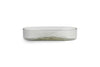 The Ilcoso Recycled Hammered Glass Soap Dish by nkuku features clear, rectangular glass with rounded corners, a low wide profile, and a subtle wavy texture. Shown empty against a plain white background.
