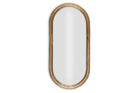 The Mbwa Oval Mirror by nkuku features a reflective surface and an antique brass, textured frame, shown against a plain white background.